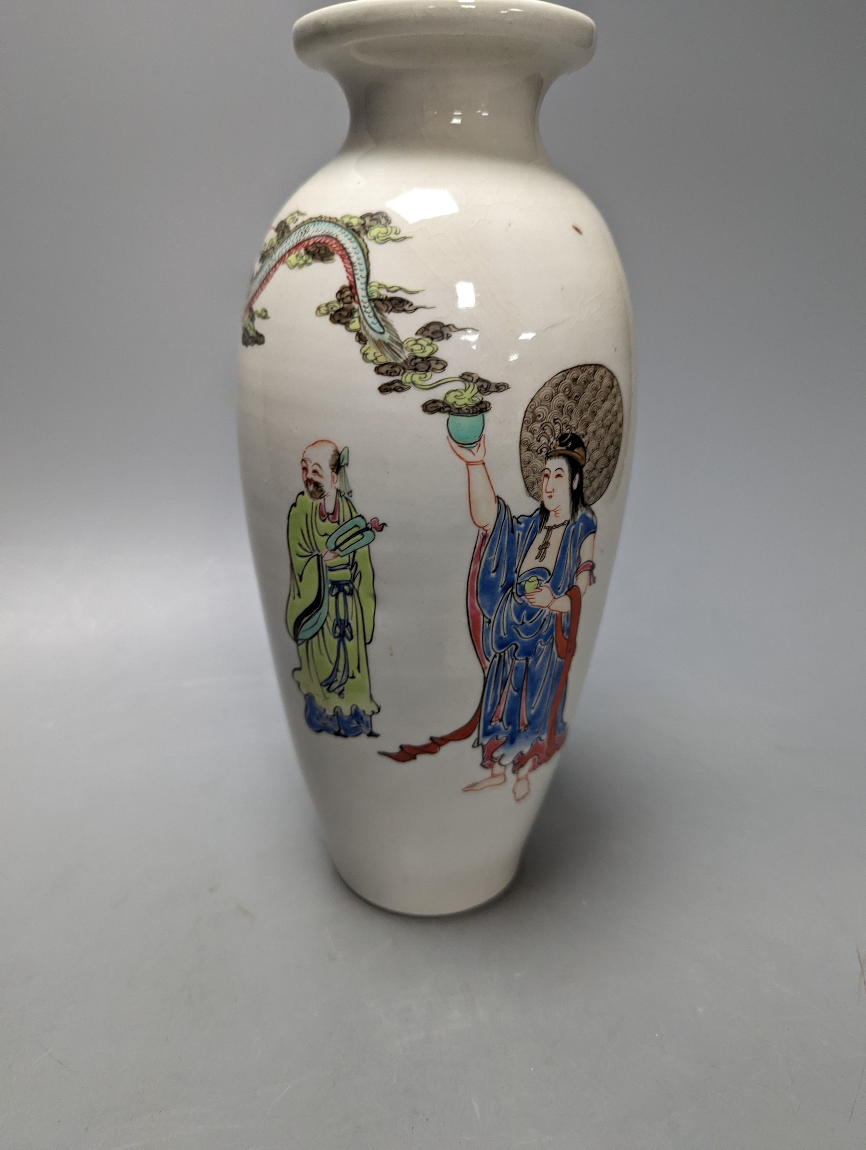 An unusual Worcester polychrome enamelled vase, c.1755-60, of unusual shape, finely painted with a Chinese immortal summoning a dragon with two sages and a boy, 24cm high, cracked, rim faults